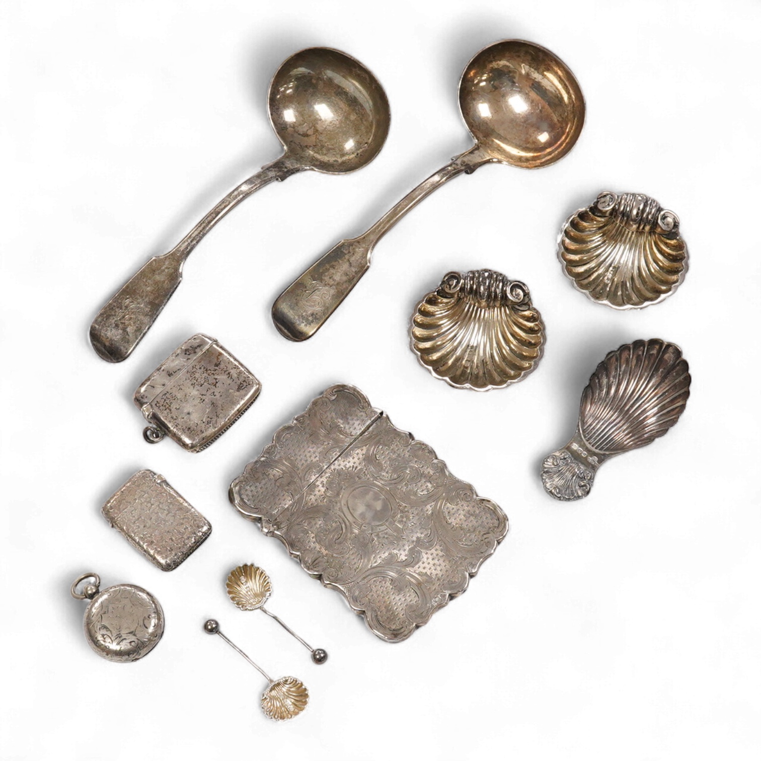Small silver including a pair of Victorian provincial fiddle pattern sauce ladles, Robert Williams & Sons, Exeter, 1845, 16.6cm, a Victorian card case by Hilliard & Thomasson, two vesta cases, a sovereign case, a 1970's